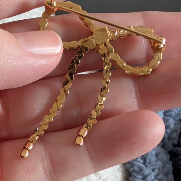 Vintage Avon gold tone bow brooch with silver rhinestones - Picture 3 of 6